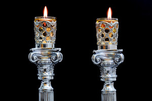 Shabbat candles. Silver candlesticks with olive oil