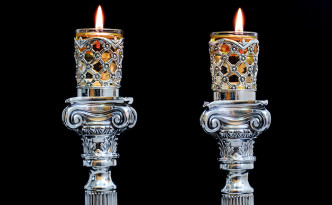 Shabbat candles. Silver candlesticks with olive oil